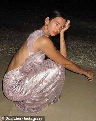 Hot stuff: The singer, 26, slipped her enviable physique into a shimmering pink maxi dress