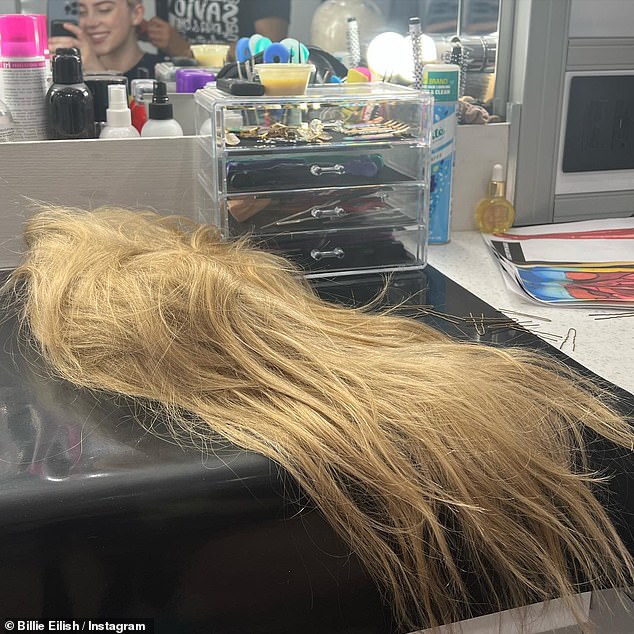 Wig off: Another snap saw her wig laying in the makeup room after she took it off for the day, with he singer's face visible in the corner of a mirror