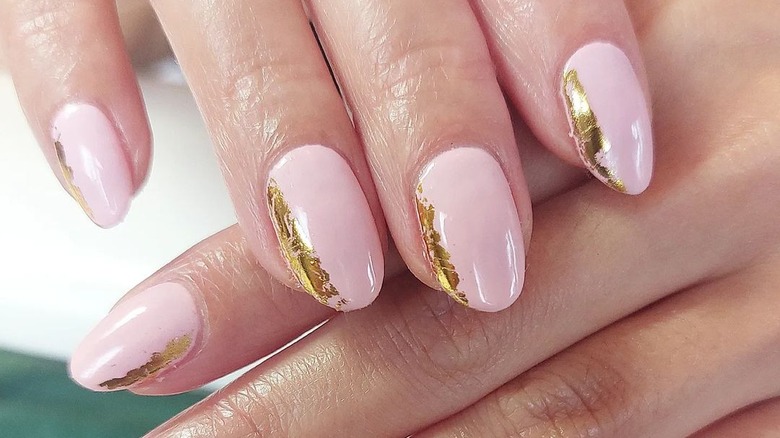 Gold foil on pink nails